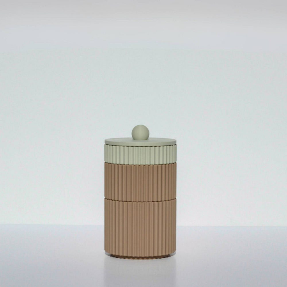 A beige and brown cylindrical coffee mega stack with a round lid on top, placed against a white background.